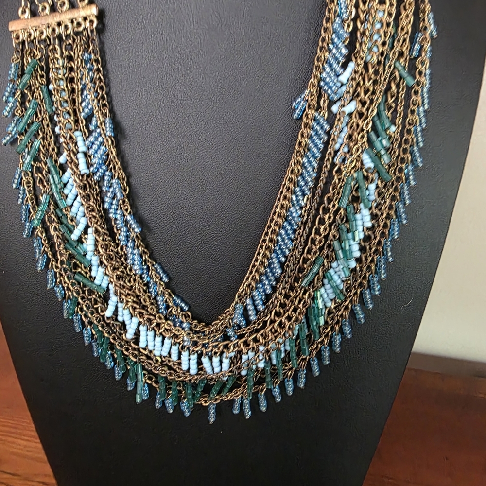 Blue and Teal energy. Layered gold chains mixed with turquoise Beads.